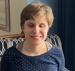 A young woman who is blind smiling