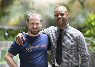 Two males smiling at the camera, one in an Easterseals shirt