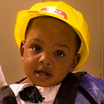 toddler boy with a construction hat on