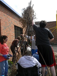 Building the teepee at Capper Foundation