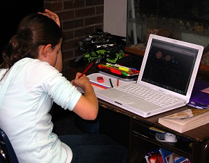 Young girl at computer desk