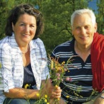 older couple in a flower field