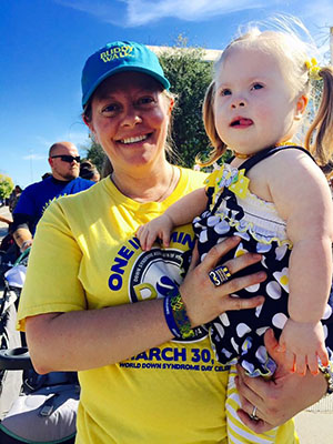 Renee holding her daughter Adelia at the Buddy Walk