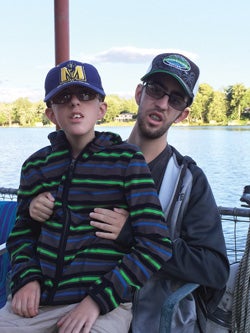 Ryan and Justin sitting on a boat