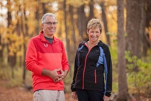 Scott and Kelly standing side by side, smiling