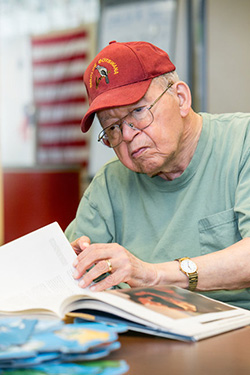 An older gentleman reading a document