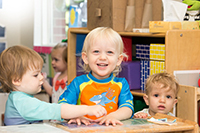 Three toddlers in a classroom
