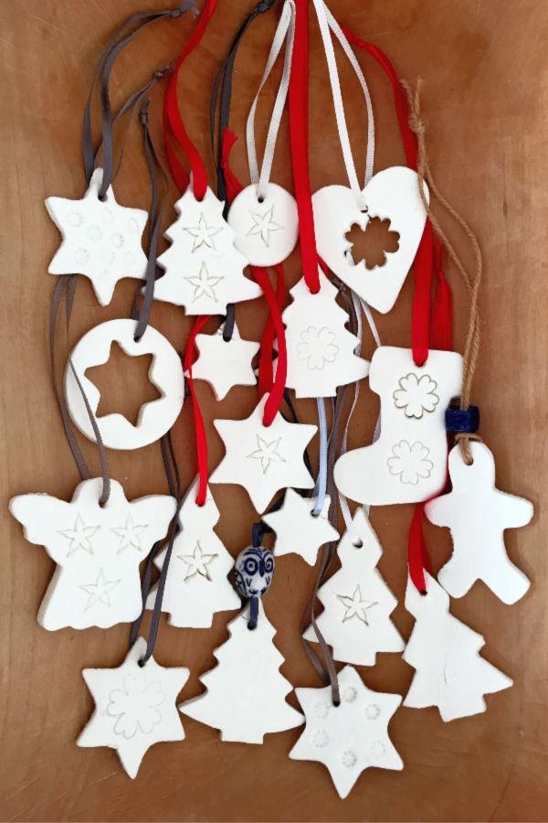 snow clay ornaments hanging from a wall or door