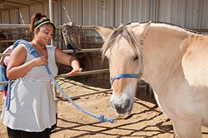 Lancaster Adult Day Service clients arriving at Saddle Up