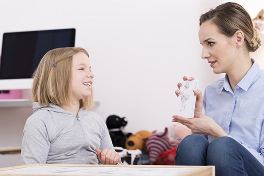 Therapist discussing drawing during play with child