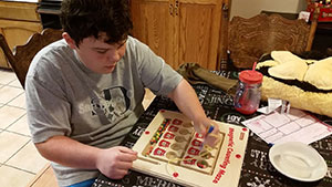 Photo of Craig playing with a puzzle