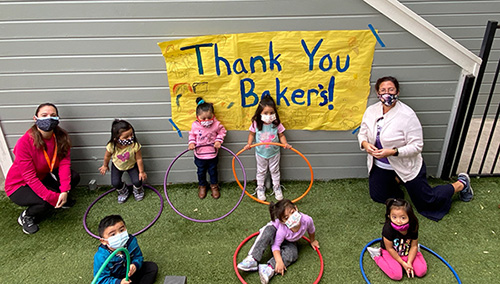 Children Thanking Bakers with a Sign