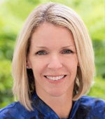 Woman with blond hair smiling.