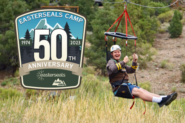 A man in a harness smiles and enjoys a zipline experience. logo says "Easterseals camp 50th anniversary"