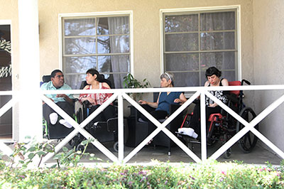 Residents on porch of the Pasadena house