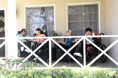 Residents on porch of the Pasadena house