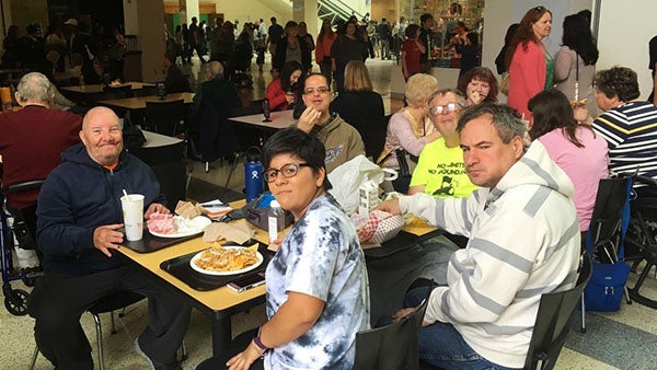 Peer group having lunch together at a table