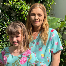 Summer (Right) with a teal and floral dress and sandy brown hair with her Mother Tiffany (L) wearing a teal top with deserts, she also has sandy brown hair. 