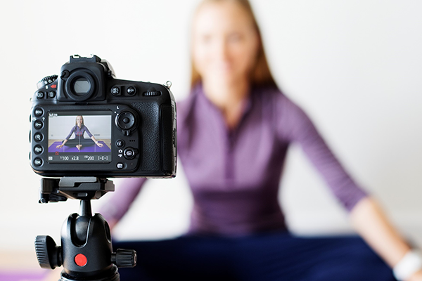 Woman stretching in front of camera