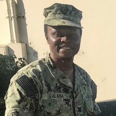 Photo shows an African American man in his Navy uniform