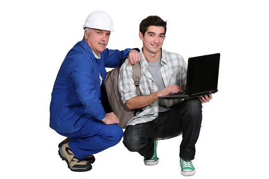 a tradesman helping apprentice