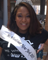 Woman in a wheelchair, wearing a tiara with "Ms Wheelchair NY" sash 