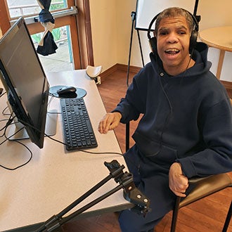 Program participant using assistive technology