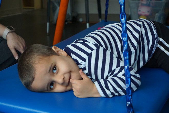 Boy on swing at Olympic Peninsula Autism Center