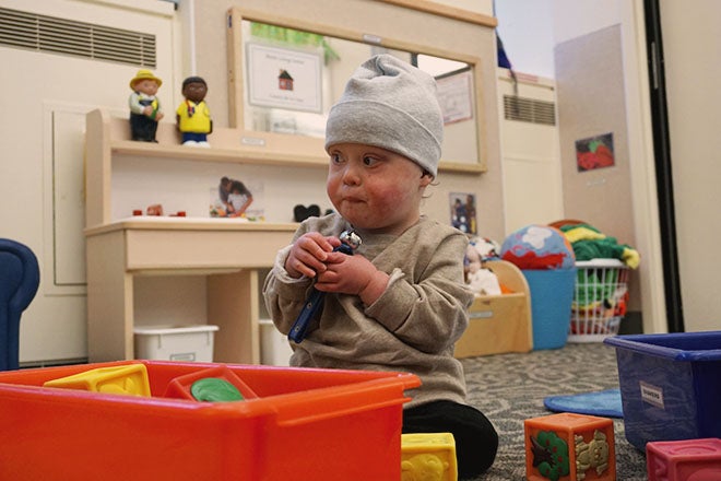 Gabriel playing with toys